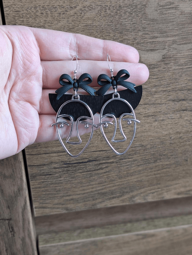 Girl in a bow earrings 